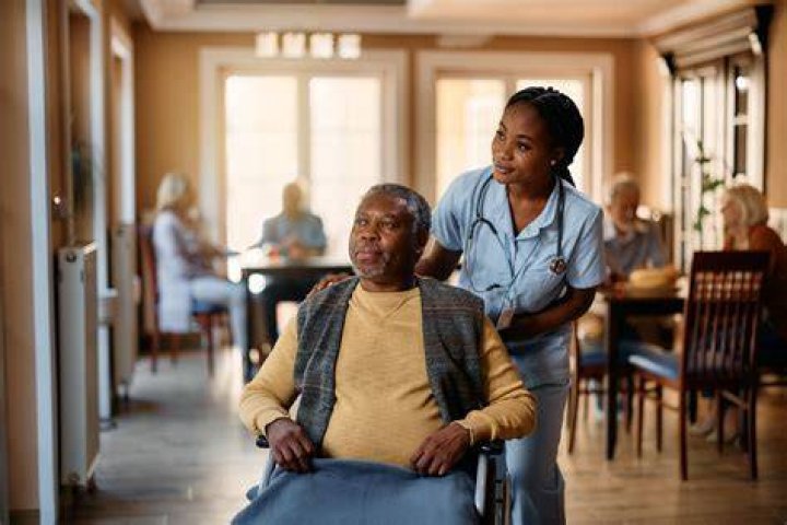 Can a person live in an assisted living facility?